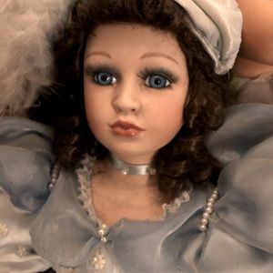 Porcelain Brunette Girl Doll Curly Hair Blue eyes